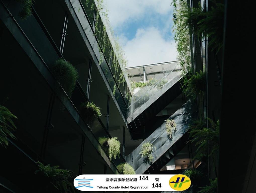 an external view of an office building with plants at Norden Ruder Hostel Taitung in Taitung City