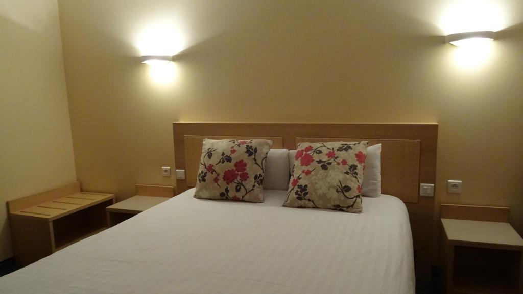 Postel nebo postele na pokoji v ubytování Residence Club Inn