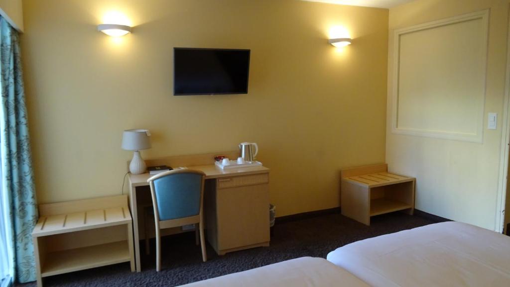 Postel nebo postele na pokoji v ubytování Residence Club Inn