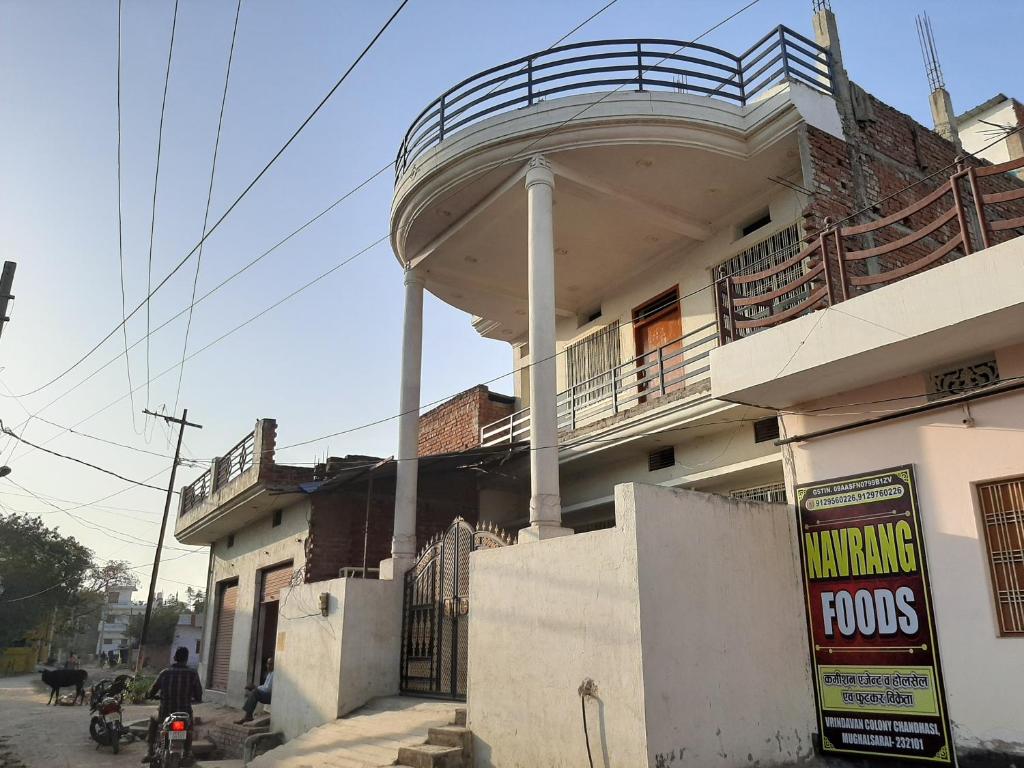 a building with a round balcony on top of it at SHYAMSHOBHA NIWAs in Chandauli