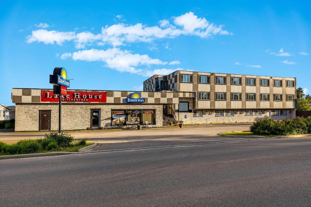 an empty street in front of a building at Days Inn by Wyndham Sylvan Lake in Sylvan Lake