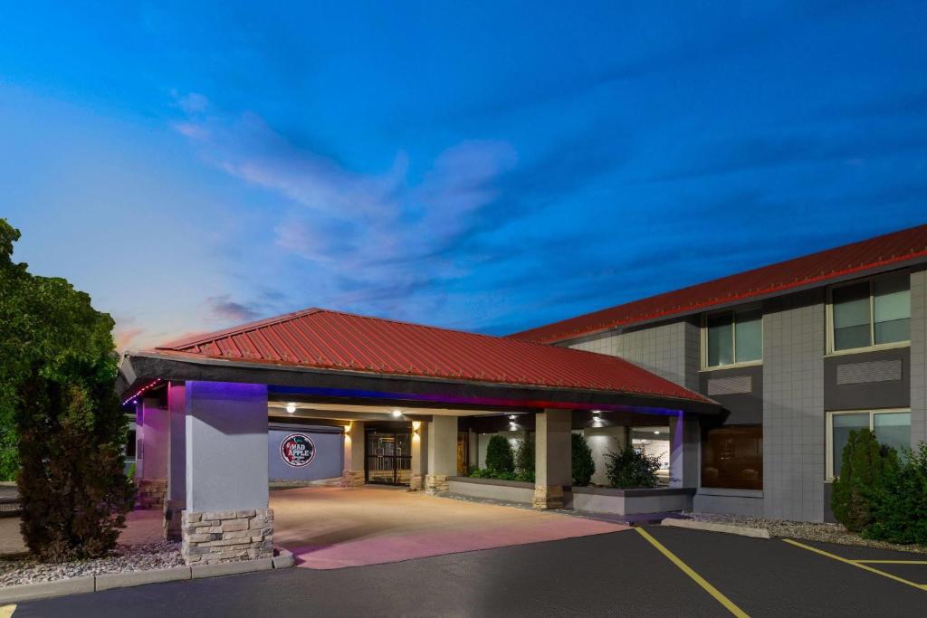a hotel with a parking lot in front of it at Americinn by Wyndham Appleton Downtown in Appleton