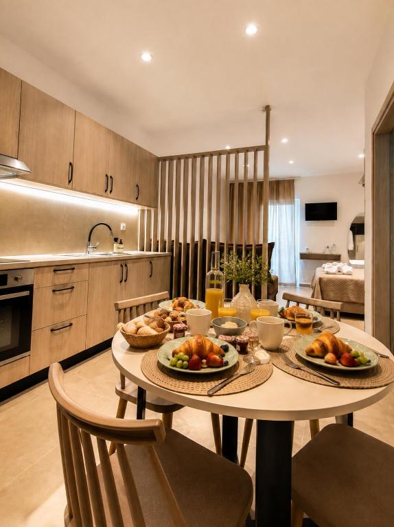 a kitchen with a table with food on it at Soula Apartments & Studios in Palaiochora