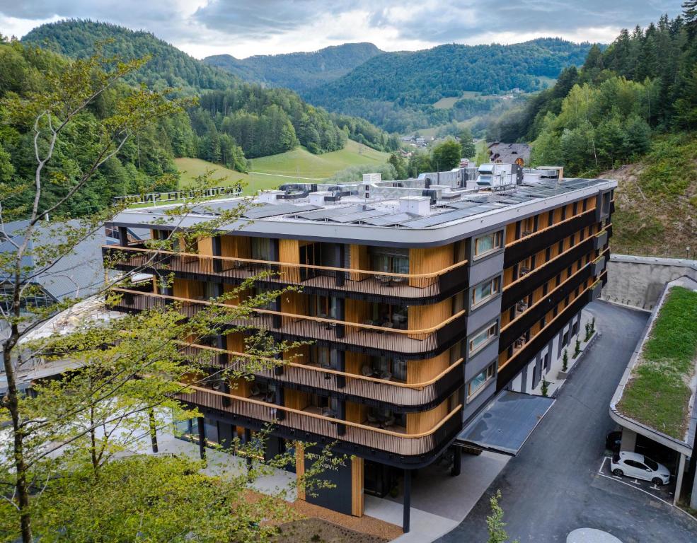 an aerial view of a building in the mountains at NaturHotel Snovik in Kamnik