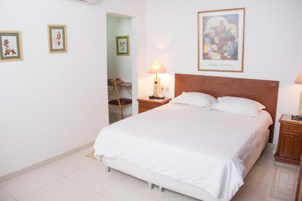 Postel nebo postele na pokoji v ubytování Beulah Hotel Boutique