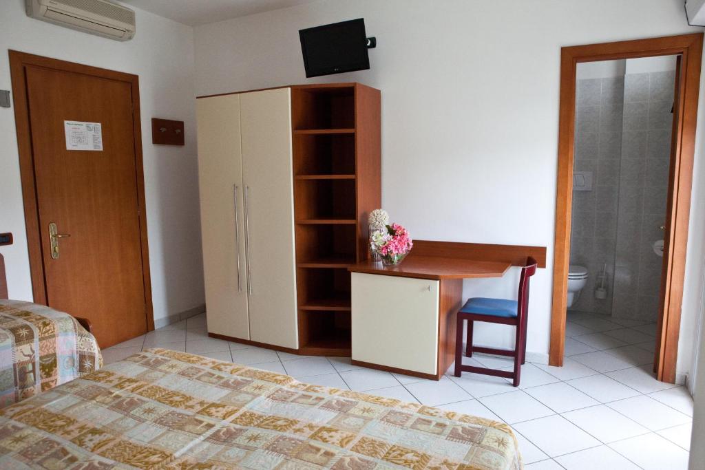 Postel nebo postele na pokoji v ubytování Hotel Clipper