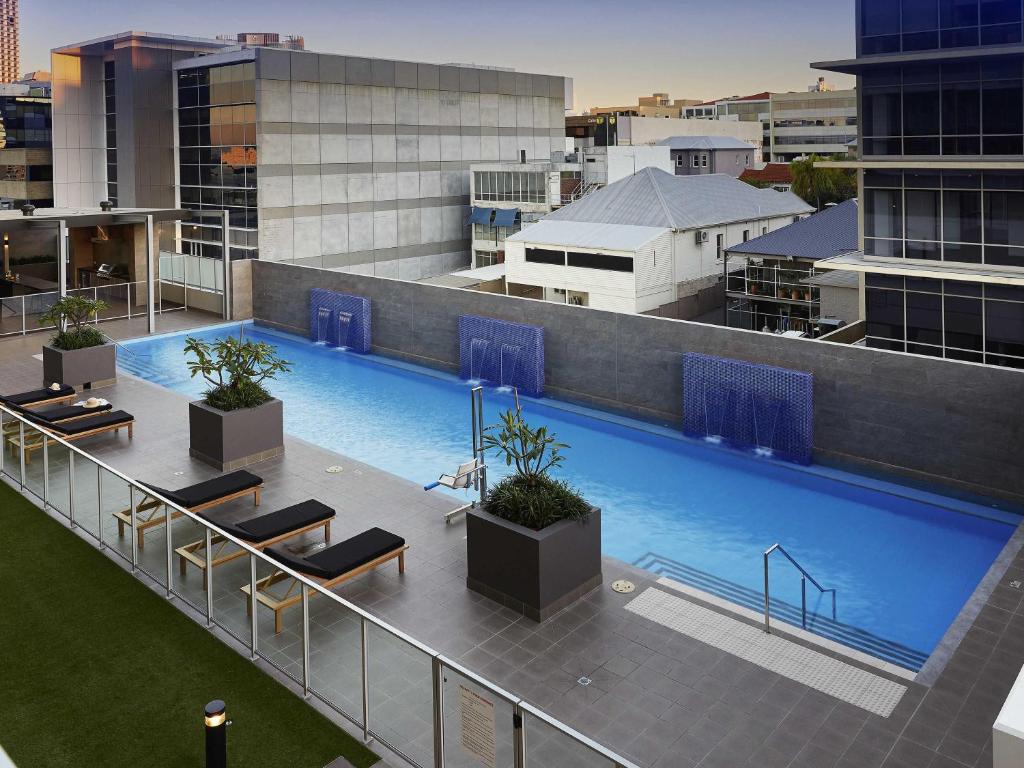 an overhead view of a large swimming pool on a building at The Sebel West Perth in Perth