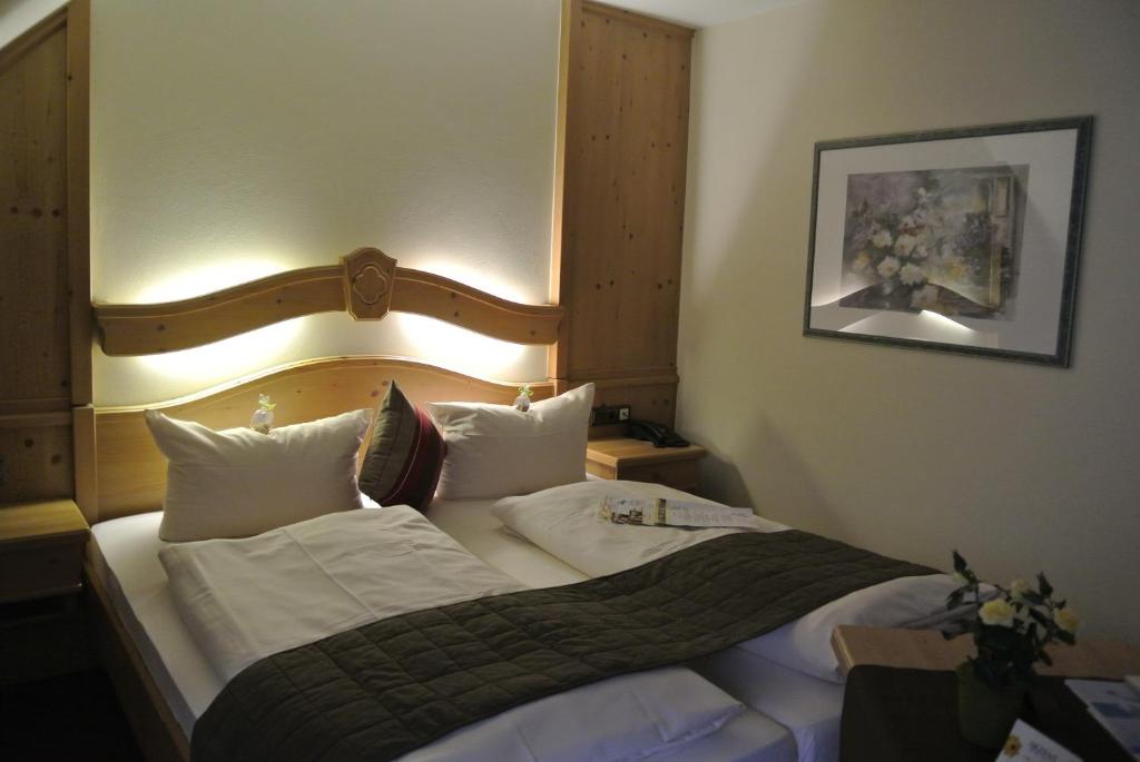 Postel nebo postele na pokoji v ubytování AKZENT Hotel Am Bach