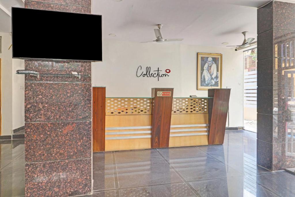 a lobby of a store with a television on a wall at Collection O SS Metro Ritz in Hyderabad