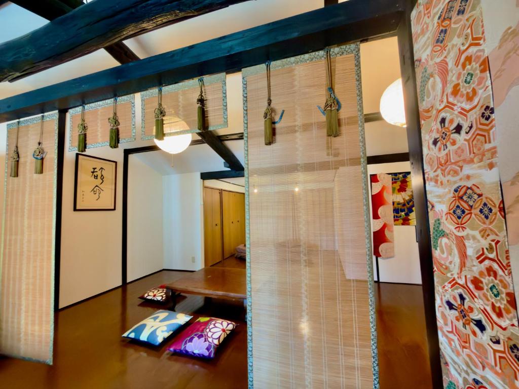 a room with a table and a glass wall at CHELSEA24 in Kyoto