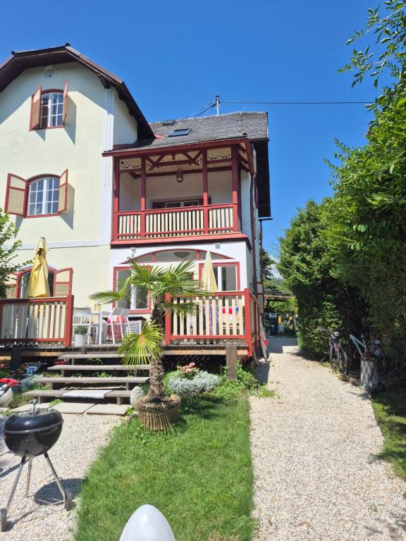 a house with a red and white at Villa Bella Vita in Seeboden