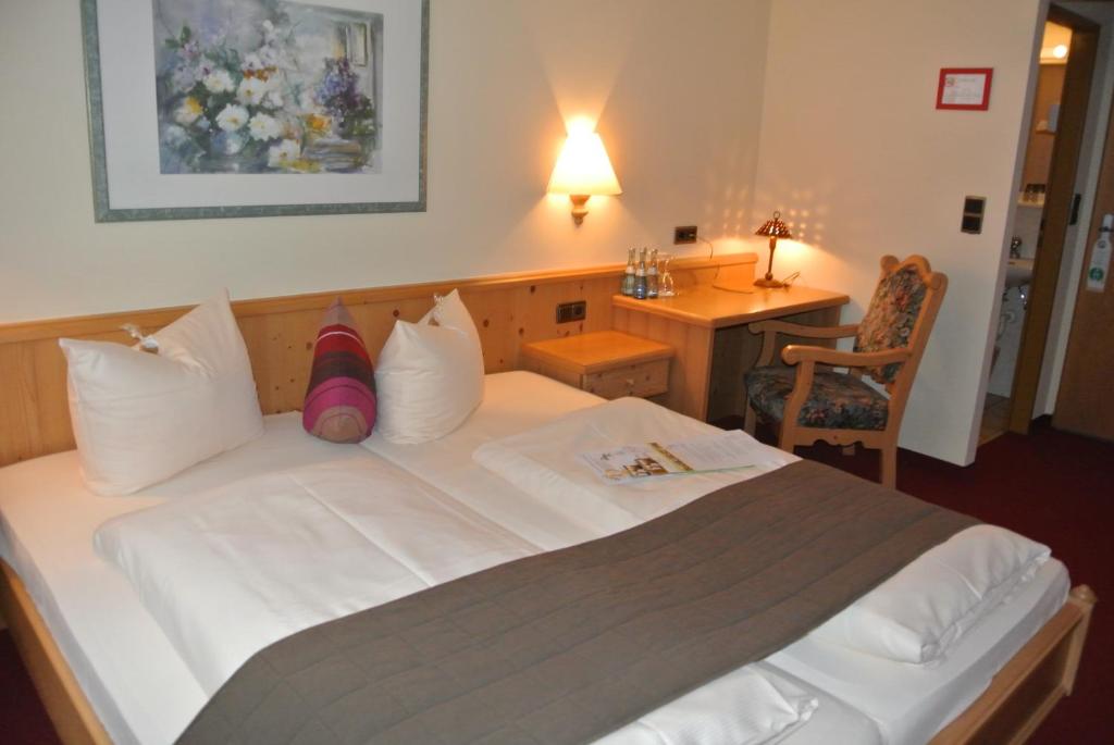 Postel nebo postele na pokoji v ubytování AKZENT Hotel Am Bach