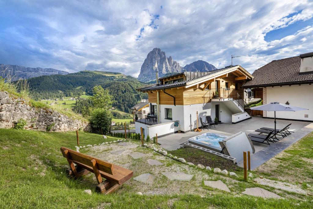a house with a view of a mountain at Dosplain Panoramic Apartments in Santa Cristina Gherdëina