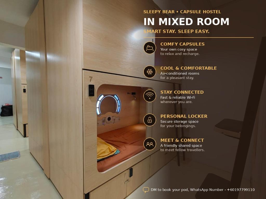 a room with a bed in a mixed room at Sleepy Bear Capsule Hostel in Johor Bahru