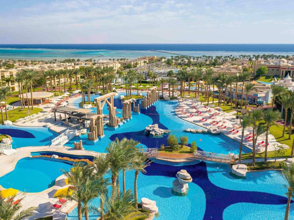 an aerial view of a resort with pools and slides at Rixos Premium Seagate in Sharm El Sheikh