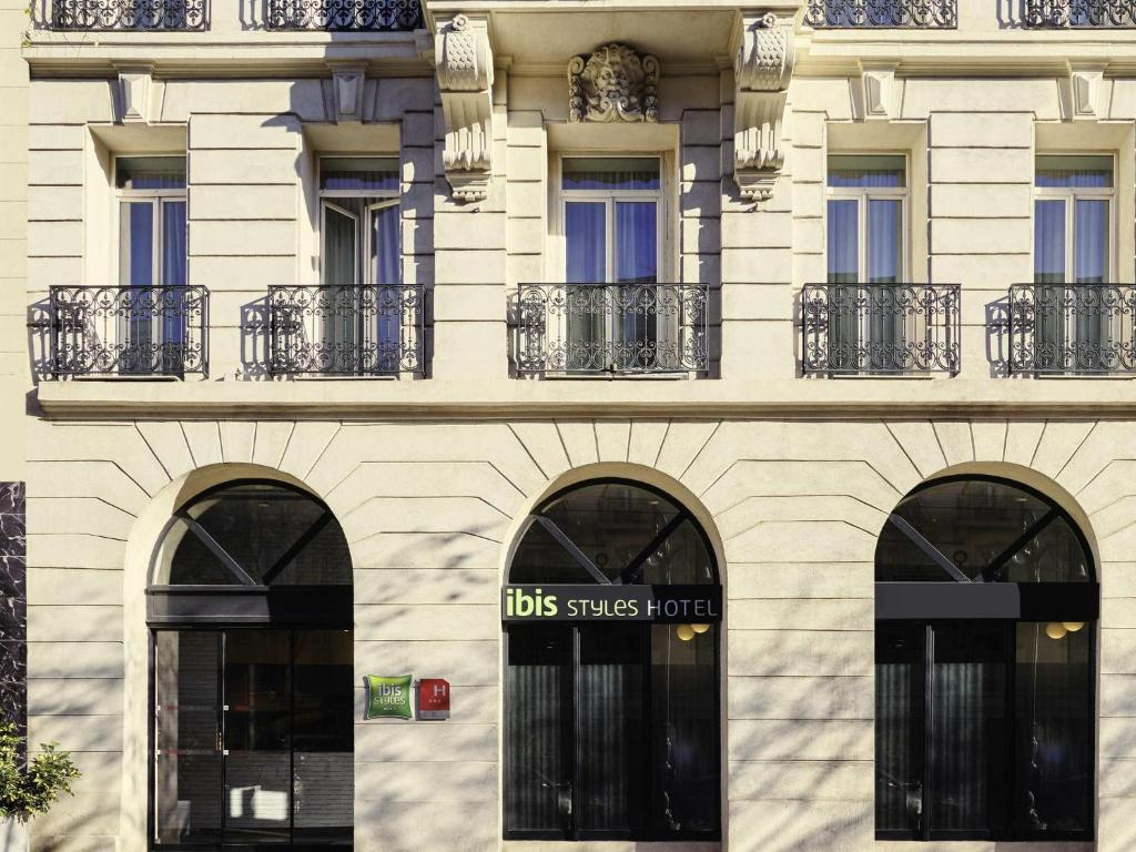 a building with three windows and a sign on it at ibis Styles Marseille Gare Saint-Charles in Marseille