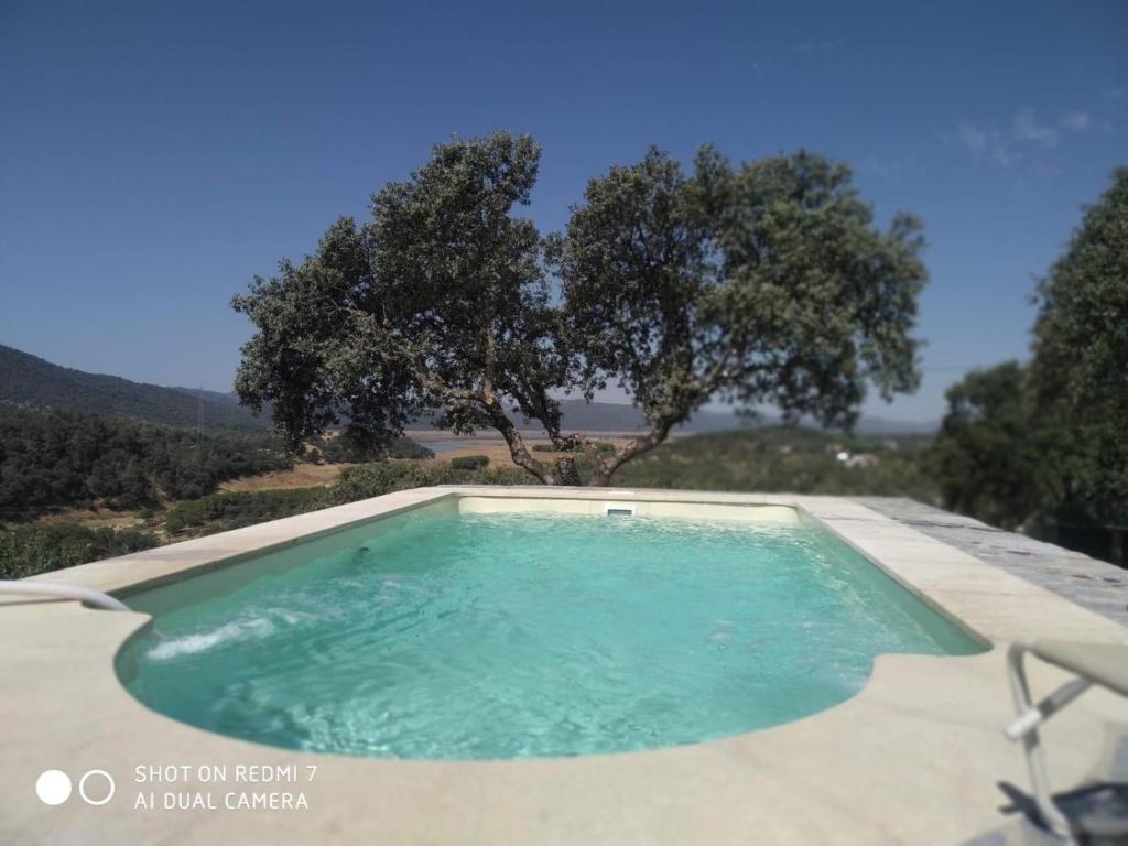 a small swimming pool with trees in the background at Mi Descanso in Córdoba