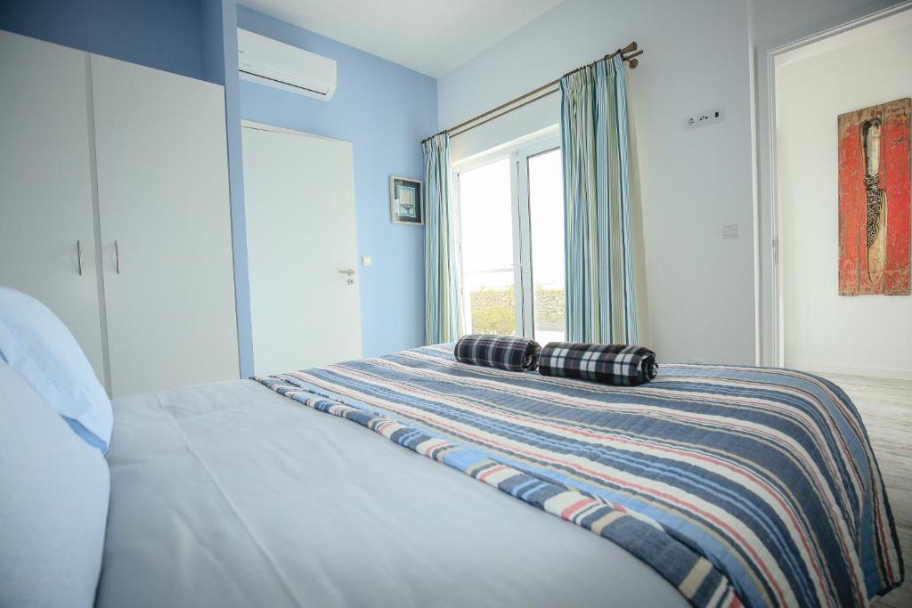 Postel nebo postele na pokoji v ubytování Quinta das Giestas