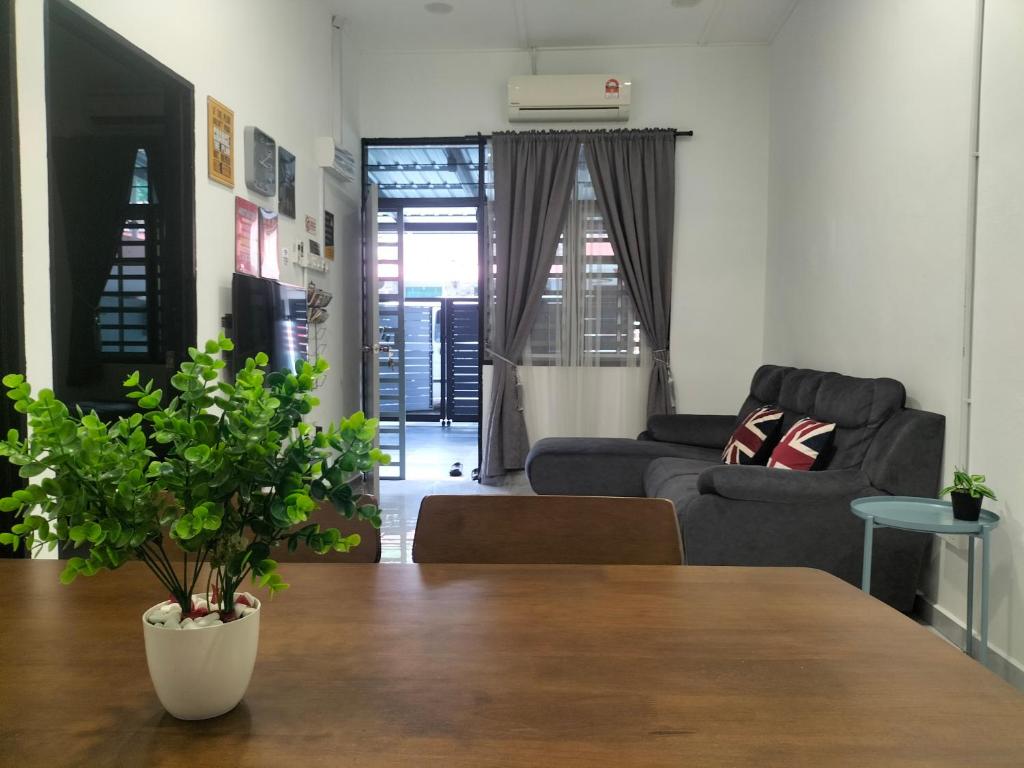 a living room with a couch and a table at 910 Entire Homestay Seremban Town, Templer, Lobak, Lekas Highway in Seremban