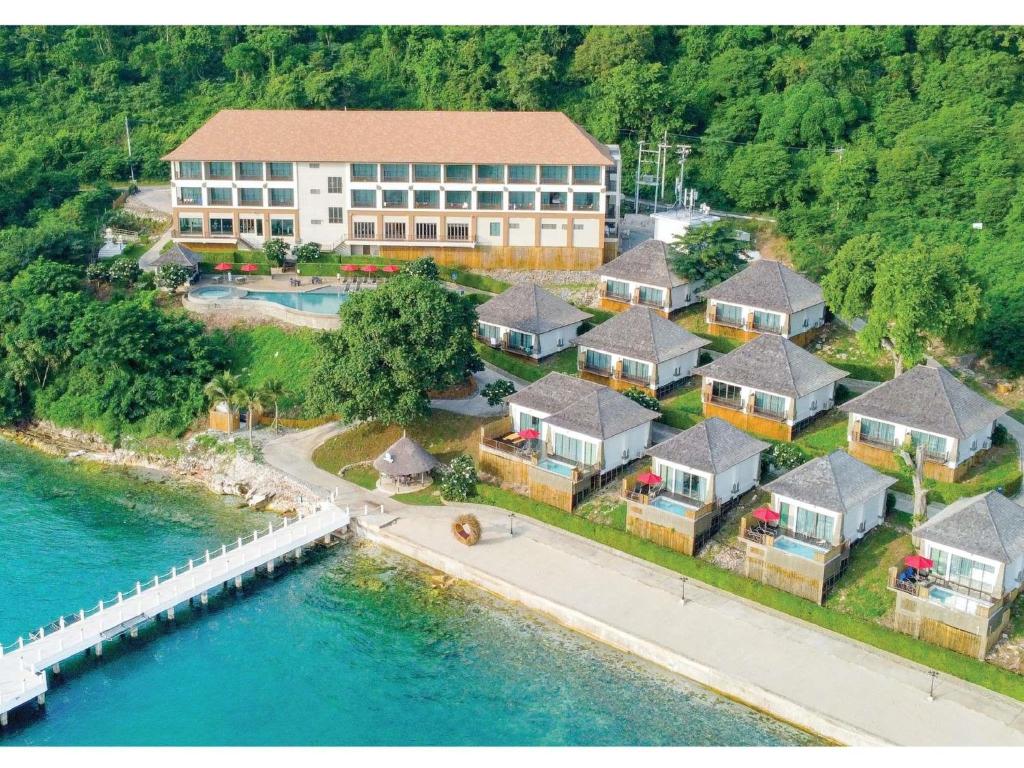 an aerial view of a house next to the water at Novotel Koh Si Chang in Ban Phanu Rangsi