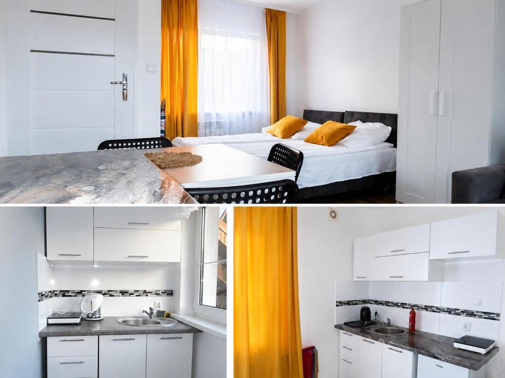 a hotel room with a bed and a sink at U KAZI in Niechorze