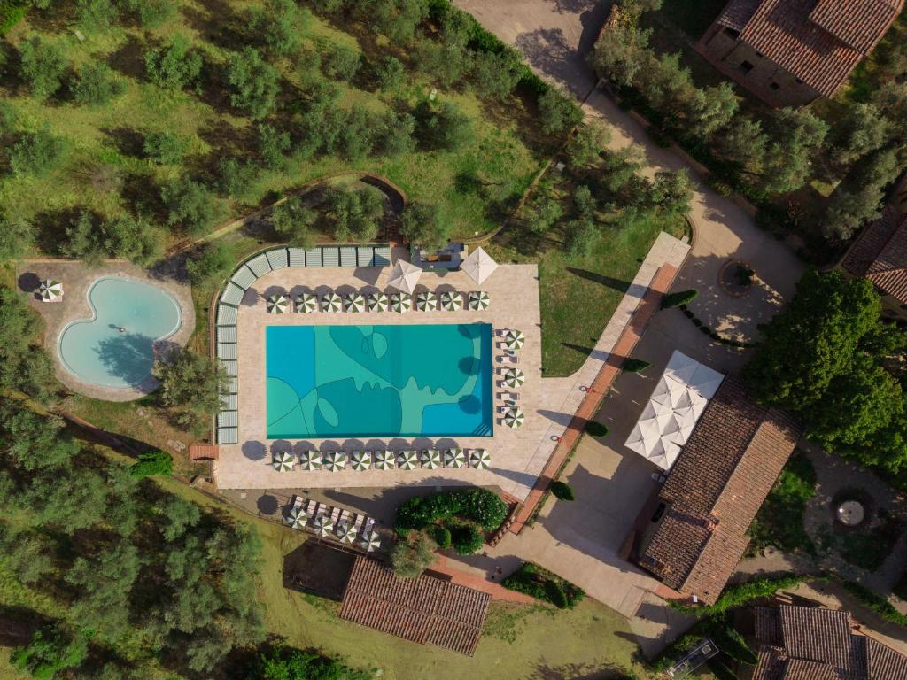 an overhead view of a building with a swimming pool at Chapter Chianti, a Member of Design Hotels in Cavriglia