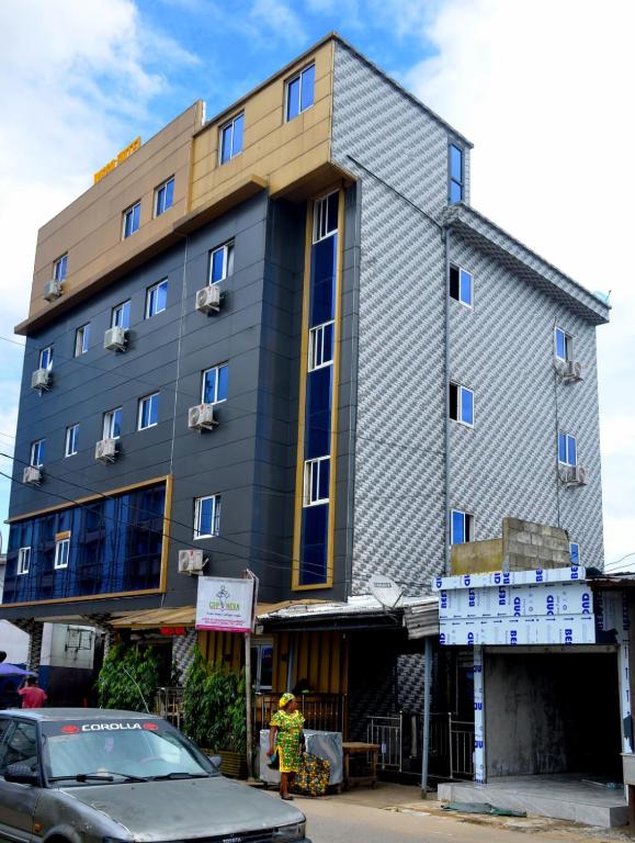 a building on the side of a street at Bisso Hotel Bonaberi in Douala