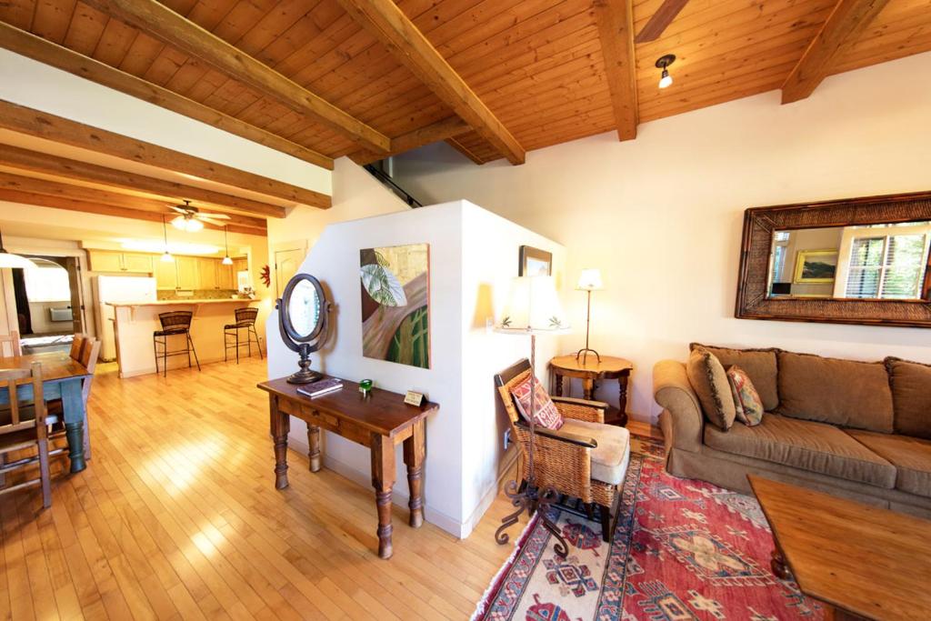 a living room with a couch and a table at Blue Iguana Inn in Ojai