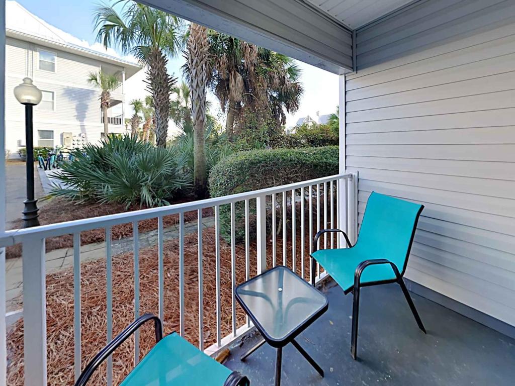 two chairs and a table on a porch at Beachside Villas #413 in Seagrove Beach
