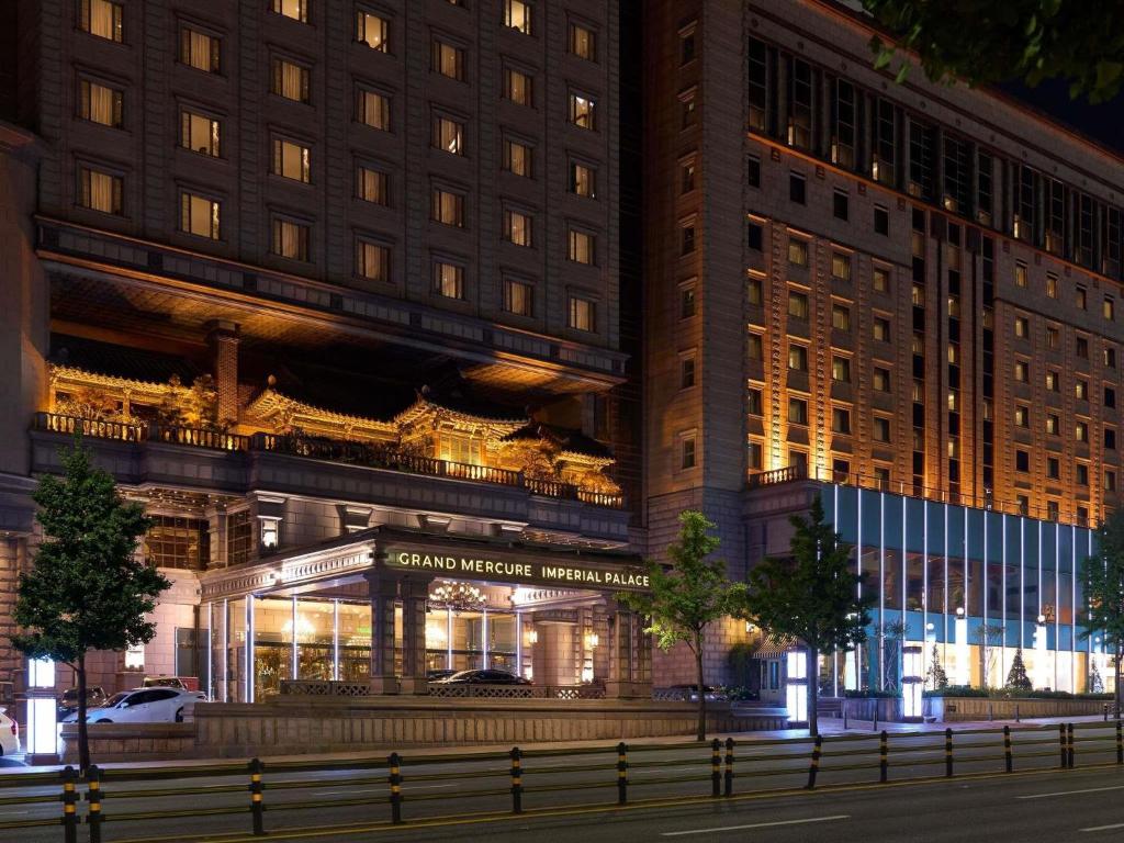 a building with a sign on the front of it at Grand Mercure Imperial Palace Seoul Gangnam in Seoul