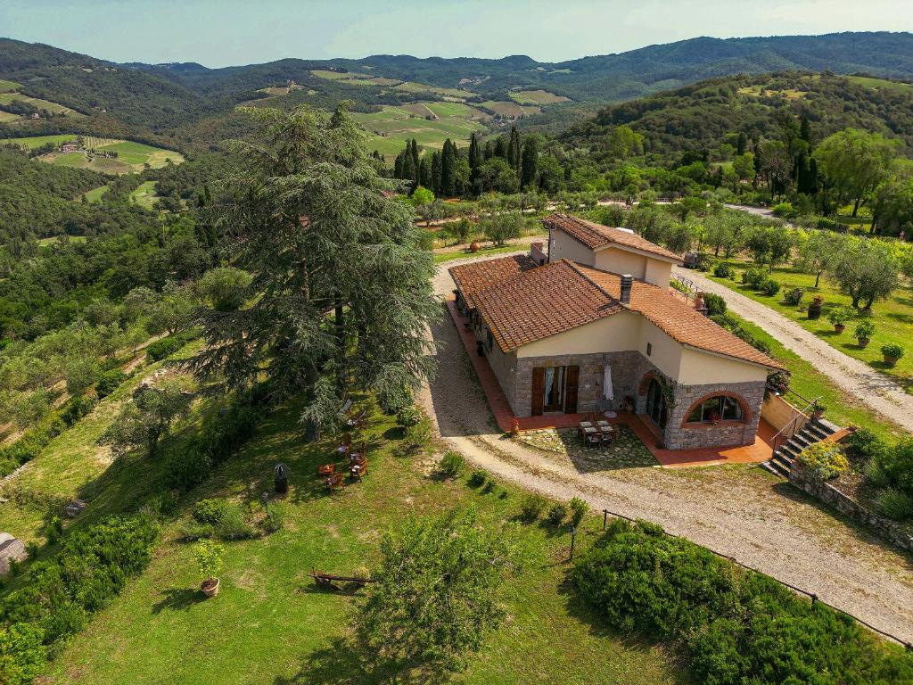 an aerial view of a house on a hill at Tenuta il Poggetto in Radda in Chianti