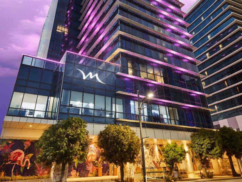 a building with a sign on the side of it at Mercure Mactan Cebu in Mactan