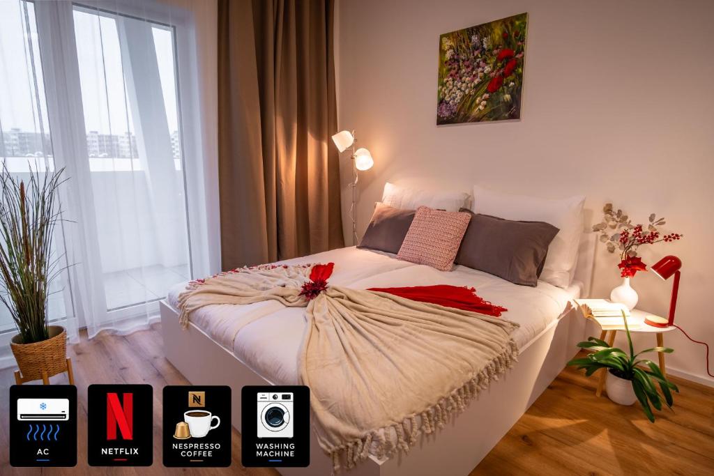 a bedroom with a white bed with red bows on it at Sweet Embrace in Brno