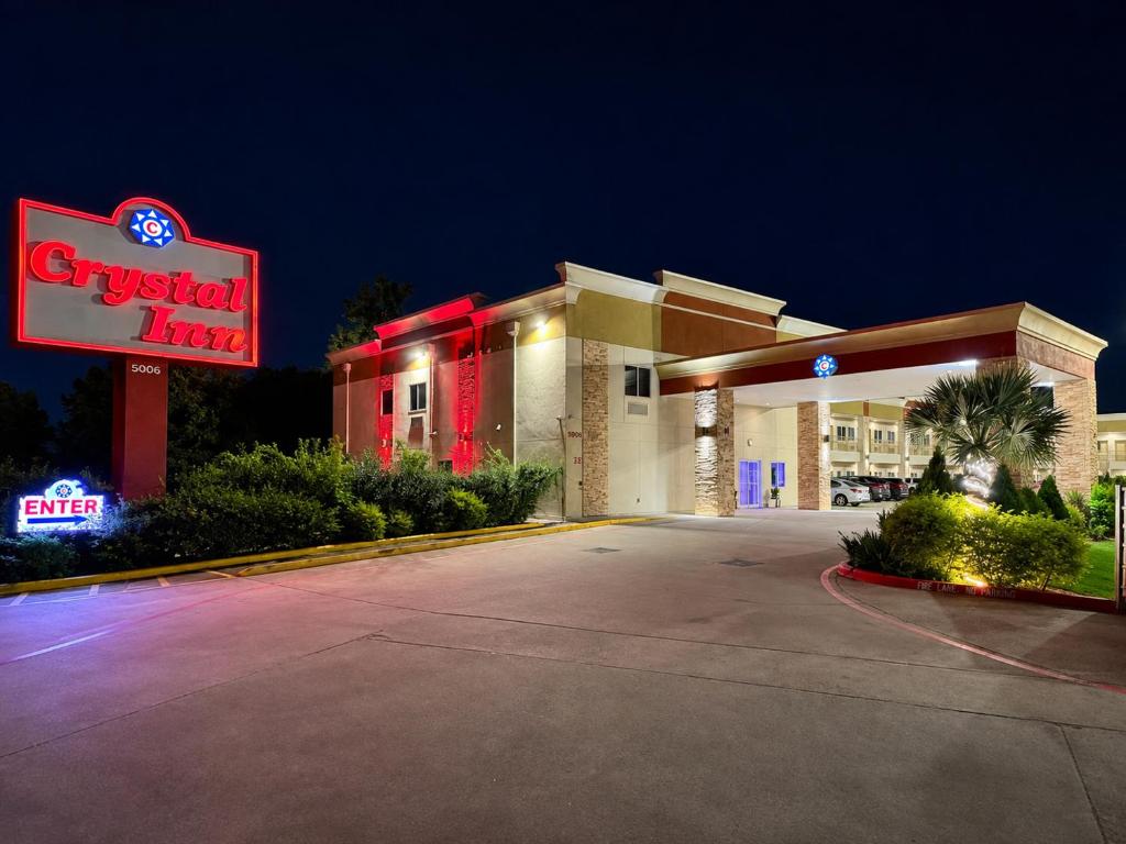 a fast food restaurant with a sign in front of it at Crystal Inn Downtown in Houston