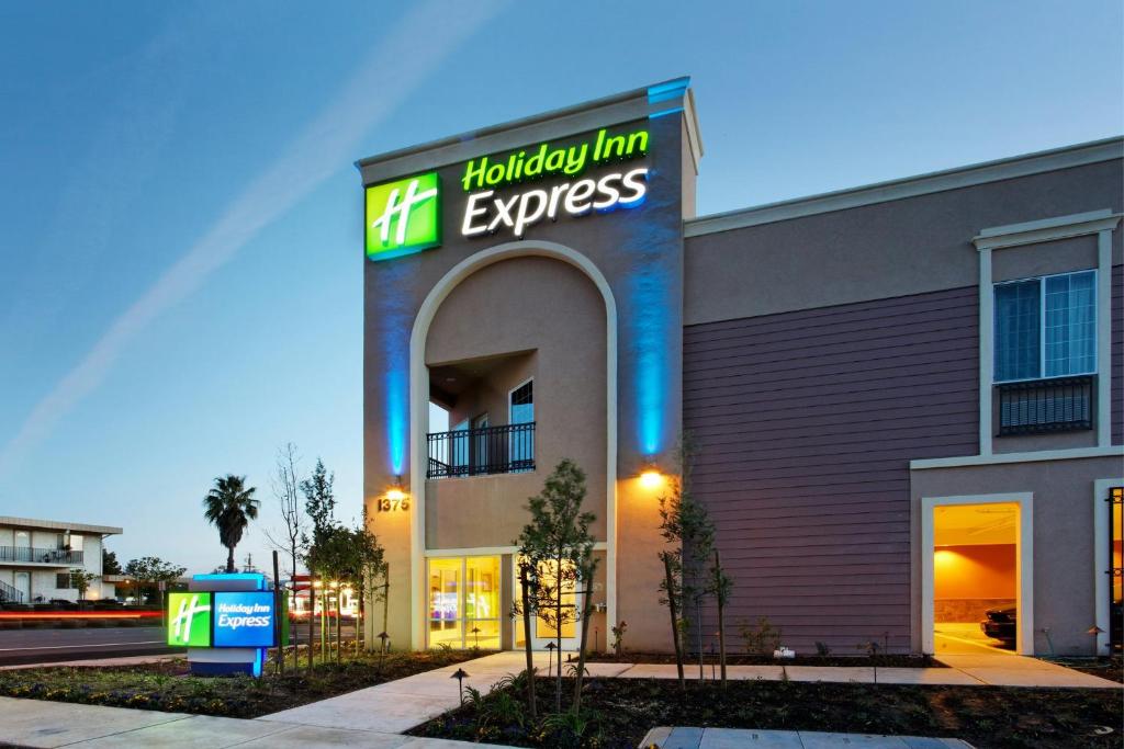 a holiday inn express building with a sign on it at Holiday Inn Express Benicia by IHG in Benicia