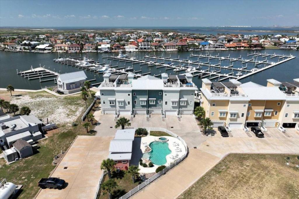 an aerial view of a marina with houses and boats at Port A Del Rey in Port Aransas