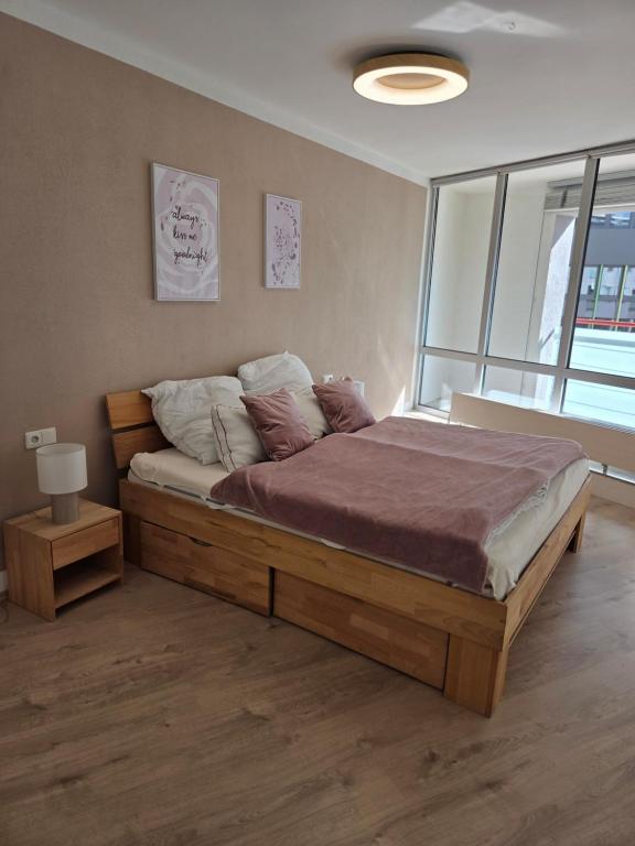 a bedroom with a large bed in a room at Brenz City Stay in Heidenheim an der Brenz