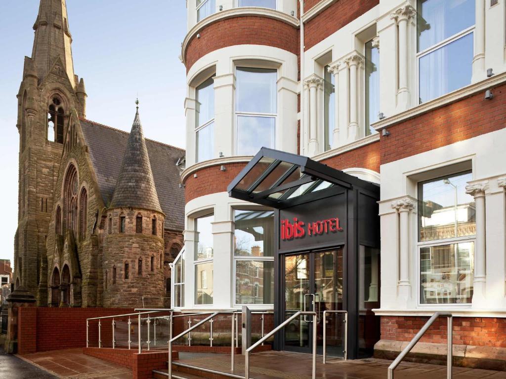 a bus stop in front of a church at ibis Belfast Queens Quarter in Belfast