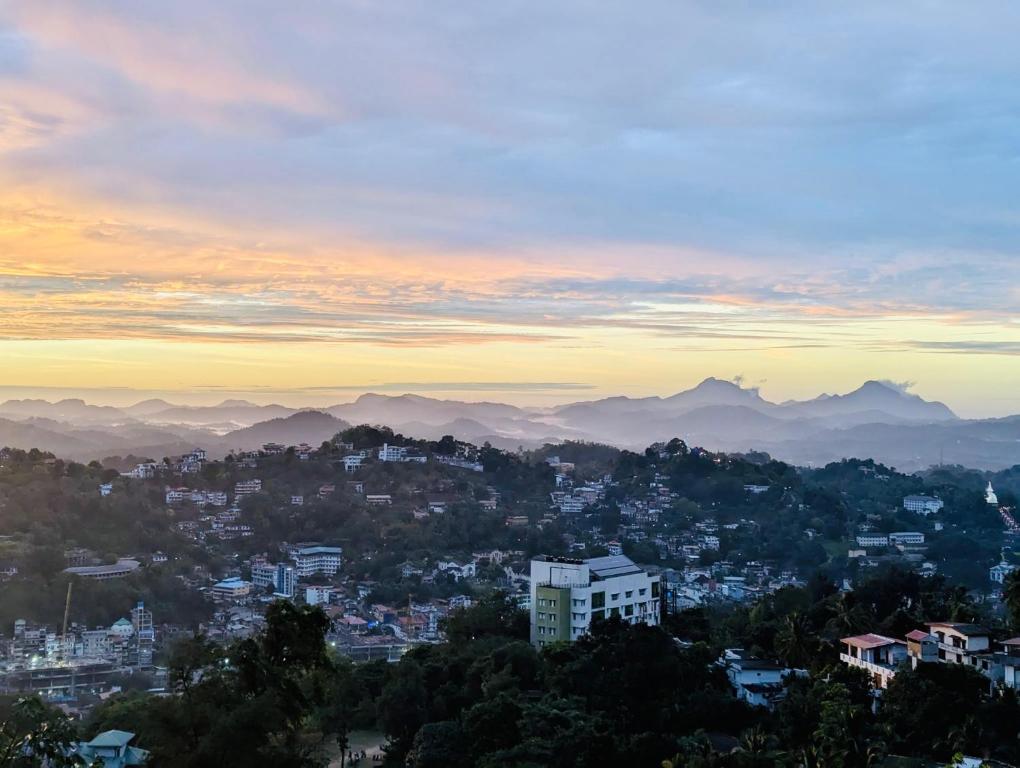 a view of a city at sunset at Namaya Nature Resort & Cafe in Kandy