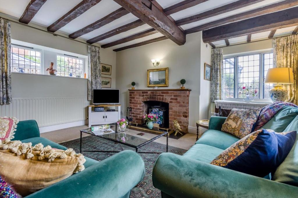 a living room with two couches and a fireplace at 2 Bed in Ludlow oc-78885 in Ludlow