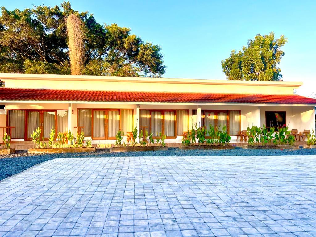 a building with a courtyard in front of it at The sonteng hills in Sengkol