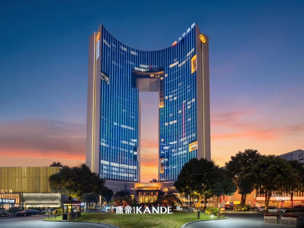 a rendering of a tall building in a city at Dongguan Kande International Hotel in Dongguan
