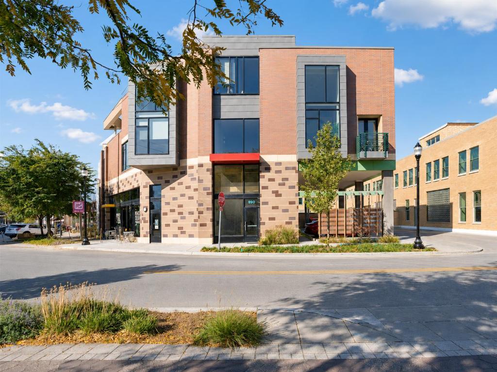 an apartment building on a street in a city at Upscale 3BR Penthouse by CozySuites in Indianapolis
