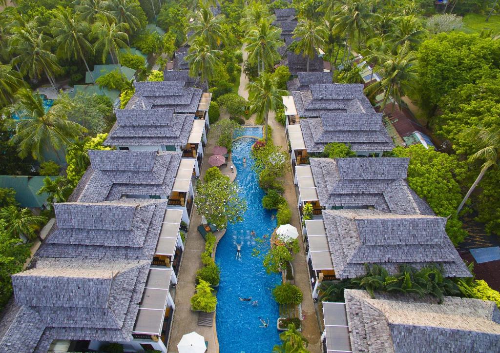an aerial view of a resort with blue water at Railay Village Resort & Spa in Railay Beach