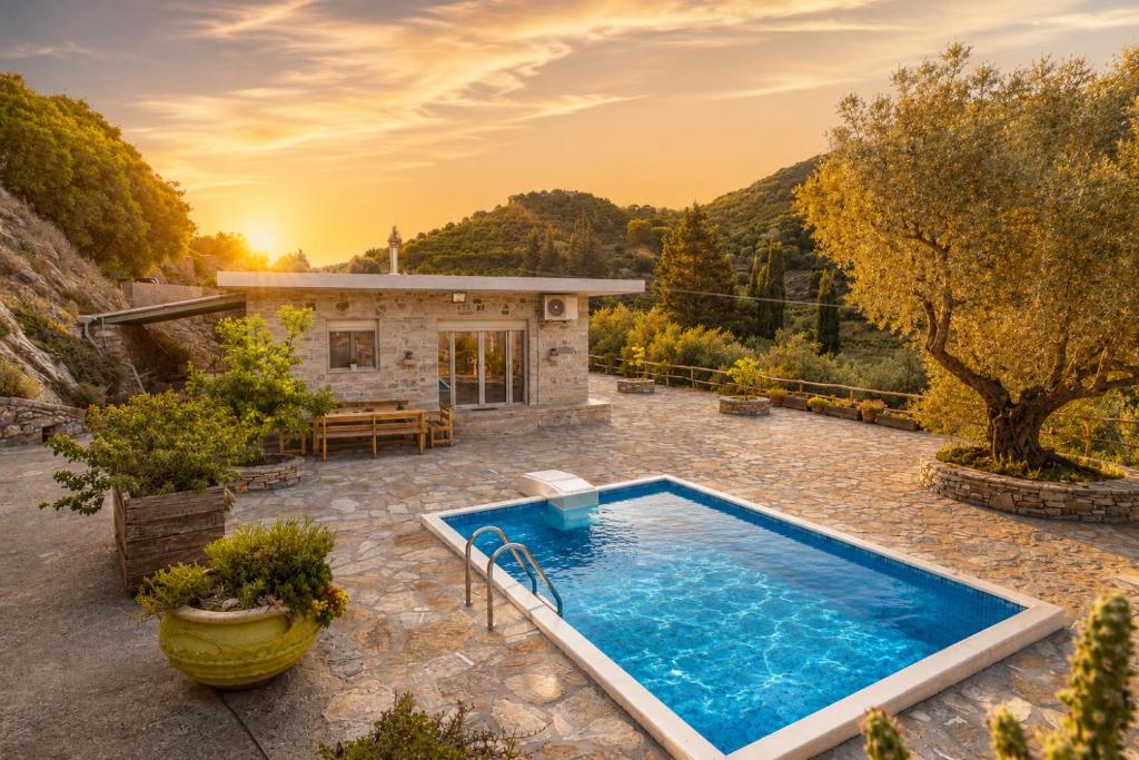 a pool in the backyard of a house at Cretan Nature Villa Alexandra in Zaros