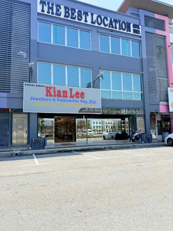 a large blue building with a sign for a store at THE BEST LOCATION in Port Dickson