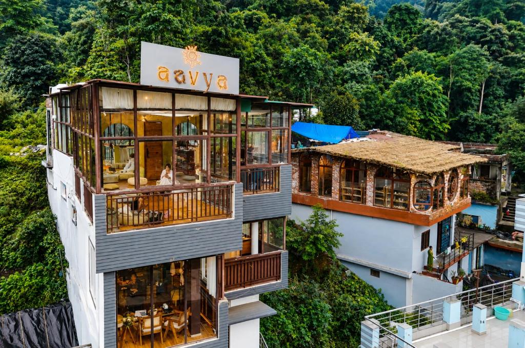 an aerial view of a building with balconies at Aavya Creative Wellness Retreats in Rishīkesh
