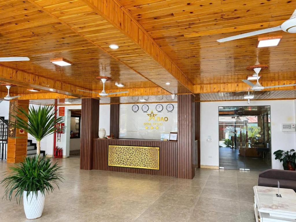 a lobby with a reception desk in a building at Ánh Sao Sapa Hotel in Sapa