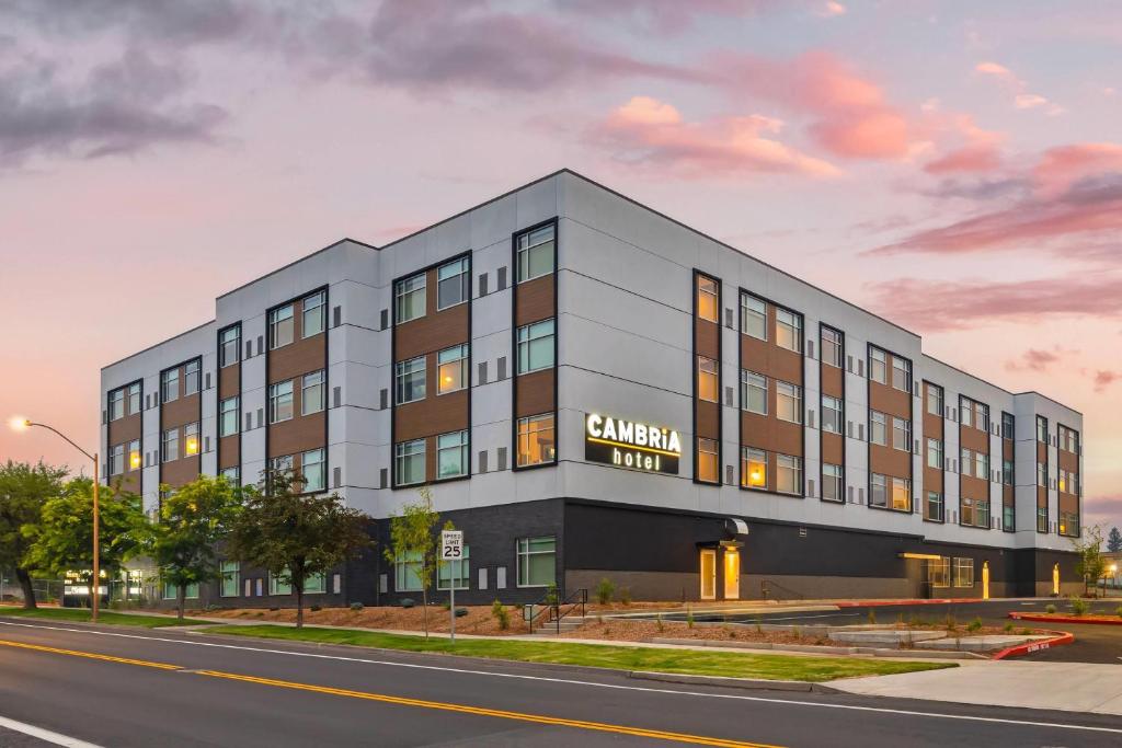 a rendering of a building on the corner of a street at Cambria Hotel Bend - Mt Bachelor in Bend