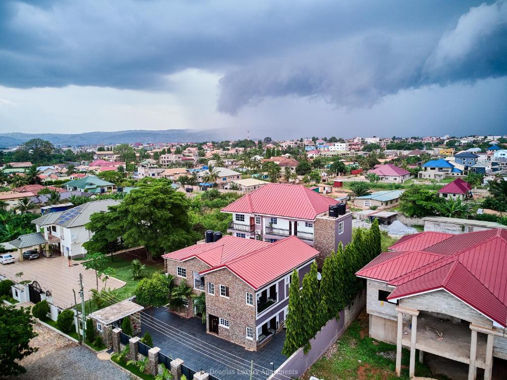 an aerial view of a city with houses with red roofs at Douglas Luxury Apartments - Douglas Court in Trofwi
